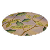 Groene en gele bladeren op zonnescherm snijplank (Hoek)