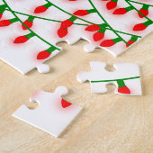Groene en rode kerstlampjes die rustreren legpuzzel (Zijkant)
