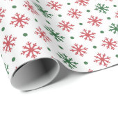 Groene en rode sneeuwvlokken op wit cadeaupapier (Rol Hoek)