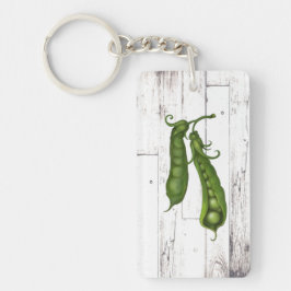 Groene erwten erwt wit hout rustieke boerderij chi sleutelhanger