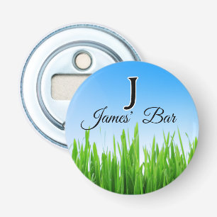 Groene gras tuin met blauwe lucht ontwerp button flesopener