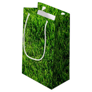 Groene grastextuur van een voetbalveld klein cadeauzakje