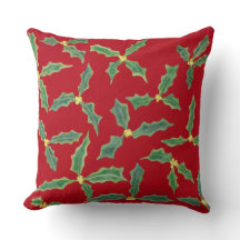 Groene Holly bladeren, gele bloemen op rode Kussen