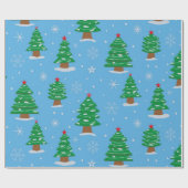 Groene kerstbomen met vallende sneeuw op blauw cadeaupapier (Vlak)
