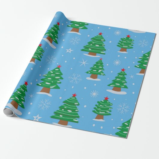 Groene kerstbomen met vallende sneeuw op blauw cadeaupapier (Uitgerold)