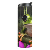 Groene kikker omringd door roze bloemen thermosbeker (Gedraaid links)