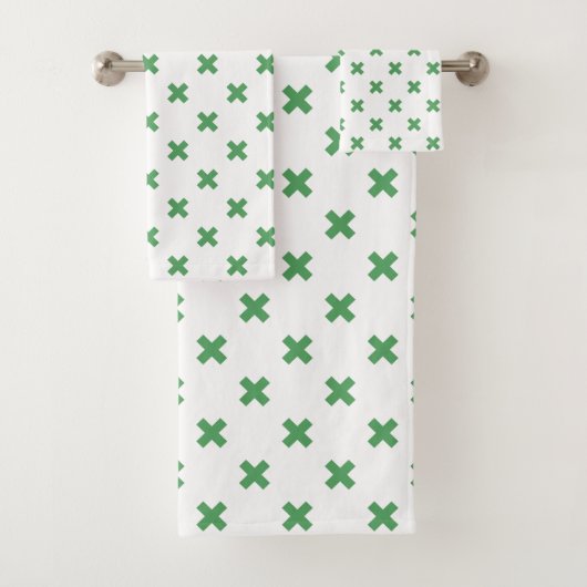 Groene kruisstiften op wit bad handdoek (Insitu)