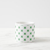 Groene kruisstiften op wit espresso kop (Voorkant)