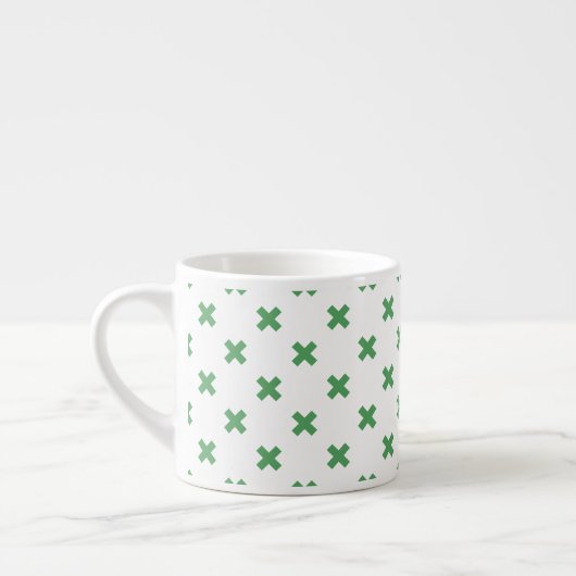 Groene kruisstiften op wit espresso kop (Links)