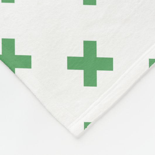 Groene kruisstiften op wit fleece deken (Hoek)