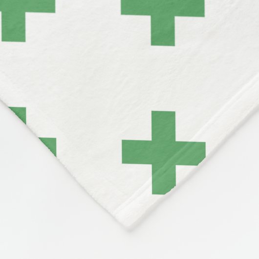Groene kruisstiften op wit fleece deken (Hoek)