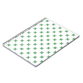Groene kruisstiften op wit notitieboek (Linkerzijde)
