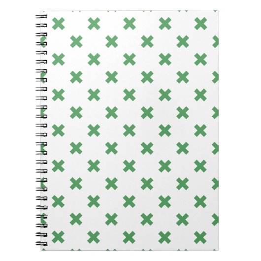 Groene kruisstiften op wit notitieboek (Voorkant)