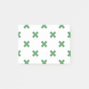 Groene kruisstiften op wit post-it® notes
