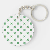 Groene kruisstiften op wit sleutelhanger (Achterkant)