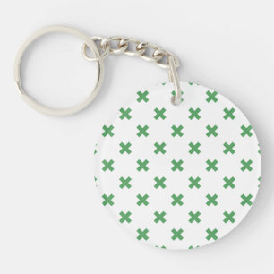 Groene kruisstiften op wit sleutelhanger