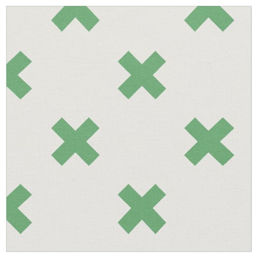 Groene kruisstiften op wit stof (Close Up)