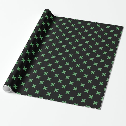 Groene kruisstiften op zwart cadeaupapier (Uitgerold)