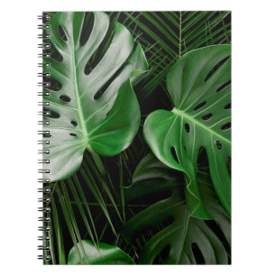 Groene monstera-bladeren en palmbladeren notitieboek
