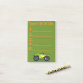 Groene monstertruck om een aanbieding te doen Post Post-it® Notes (Op bureau)