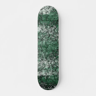 Groene oliestextuur op stokken en pluis persoonlijk skateboard
