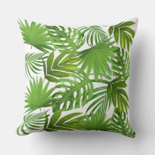 Groene palmbladeren op wit kussen