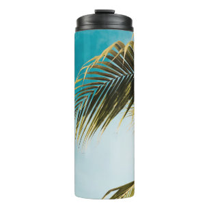 Groene palmboom onder blauwe hemel thermosbeker