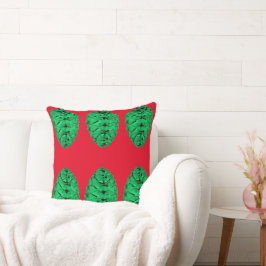 Groene Pinecones op rood kussen