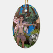 Groene pixeldraak op de arm van Avery Keramisch Ornament (Links)