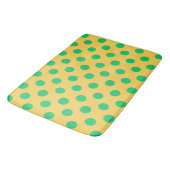 Groene polka-stippen op geel badmat (Gekanteld)
