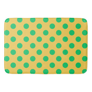 Groene polka-stippen op geel badmat