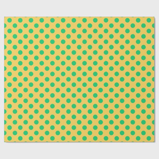 Groene polka-stippen op geel cadeaupapier (Vlak)