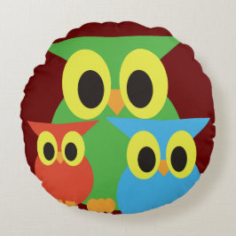 Groene, rode en blauwe uilen rond kussen