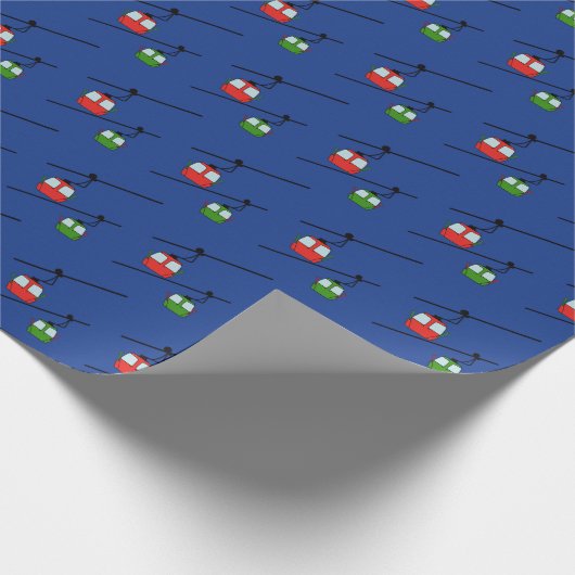 Groene & rode gondels met ski's op blauw cadeaupapier (Hoek)