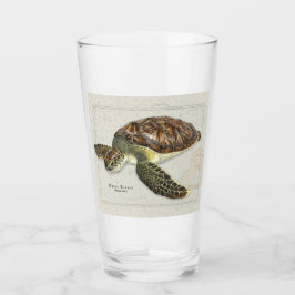 Groene schildpad over nicht Drink glas