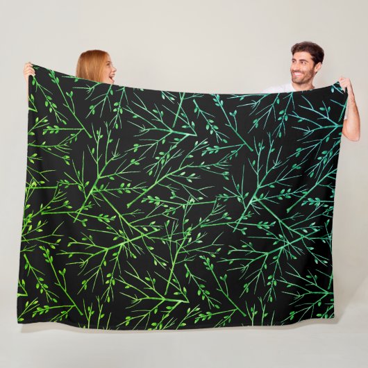 Groene takjes op zwart fleece deken (In situ)
