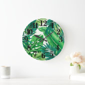 Groene tropische palmbananenmonstera lekt grote klok (Huis)