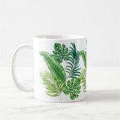 Groene tropische palmbananenmonstera lekt koffiemok (Links)