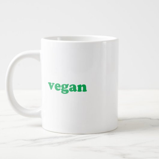 groene " veganletters " , witte achtergrond grote koffiekop (Links)