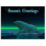 Groeten van het seizoen - Ice Edge Polar Beer Fotobeeldje Magneet<br><div class="desc">Een vreedzaam moment in de lange Arctische nacht. Een Polair Beer rust aan de rand van een open ruimte in het pakijs. De Noordelijke Lichten gloeien op afstand; heldere sterren draaien over de kop. "Seizoensgroeten" staat in gloeiend blauw en wit. Voeg je eigen tekst toe. Polaire beren worden bedreigd. Hoe...</div>