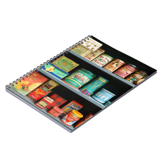 Groot collectie kleurrijke  blikken met display notitieboek (Linkerzijde)