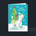 Grootzoon Kerstmis Snowman Ice Skating Feestdagen Kaart<br><div class="desc">Een super schattige en kleurrijke kerstkaart voor een jonge kleinzoon met een schattig sneeuwpopijs dat op een kleine vijver schuimt en een kleurrijke drie gebluste kerstboom met sneeuwvlokken die op een turkooisachtergrond zijn gestrooid. Snowman,  met dank aan PrettyGrafik.</div>