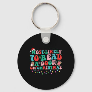 Groovy Christmas leest waarschijnlijk een boek ove Sleutelhanger