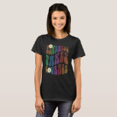 Groovy KINDNESS NEEMT COURAGE Retro tegen pesten T-shirt (Voorkant volledig)
