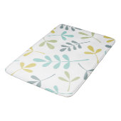 Grote geassorteerde blaadjes kleurenmix op wit badmat (Gekanteld)