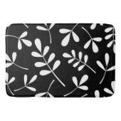 Grote geassorteerde witte blaadjes op zwart design badmat (Voorkant)
