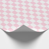 Grote lichtroze en witte cheques die papier verpak (Hoek)