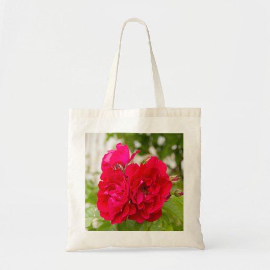 Grote rode rozen in de tuin tote bag (Voorkant)