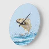 grote vis die uit het water springt klok (Hoek)