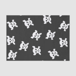 Grote witte schedel en kruisbeenderen op zwart tissuepapier